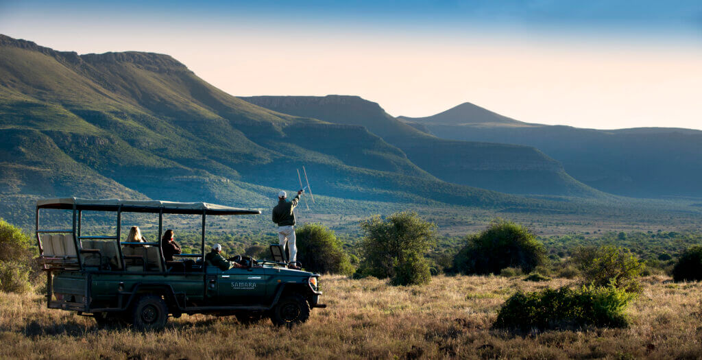 Samara vehicle tracking animals in the mountain landscape of south africa