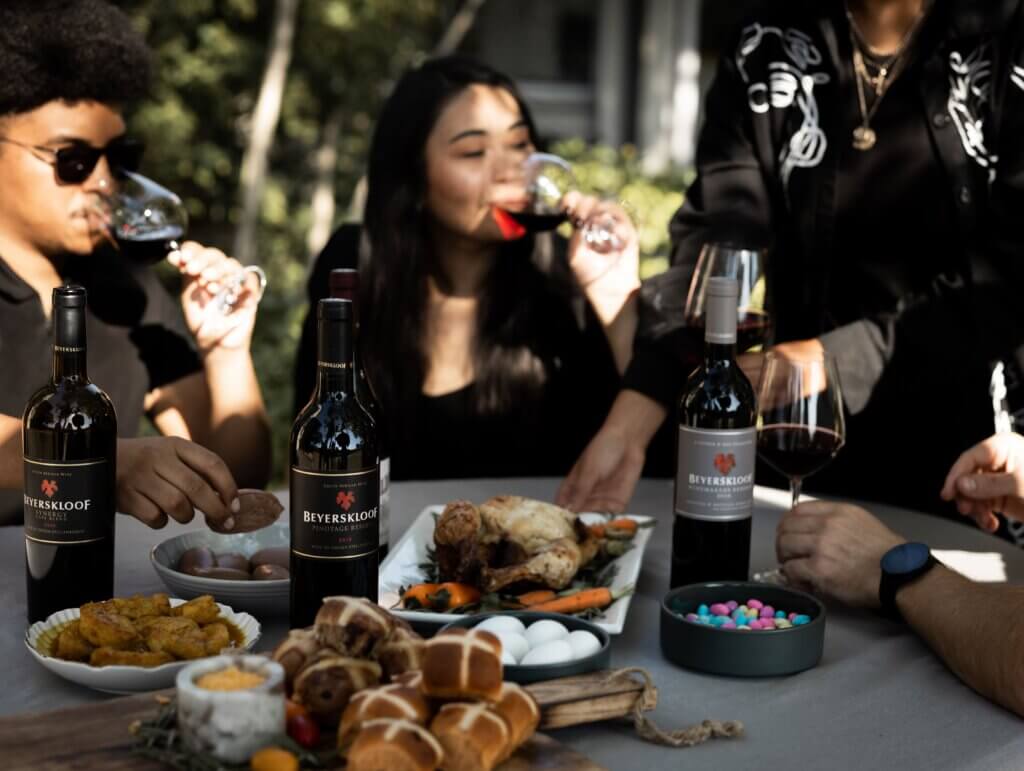 People eating a meal and enjoying beyerskloof wines